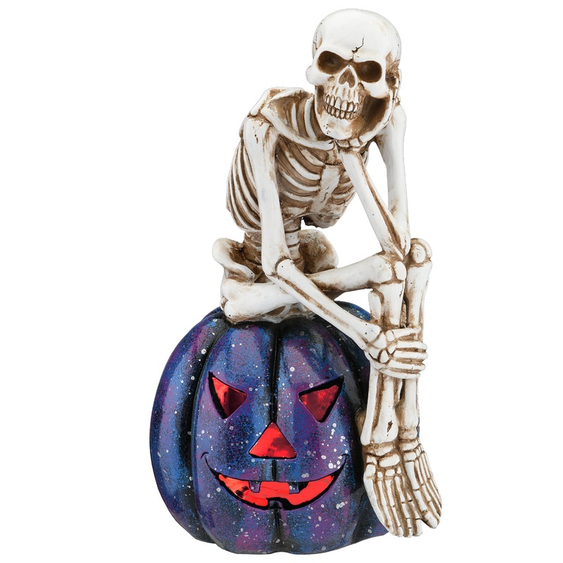 11 in. Halloween Skeleton Resting on a Purple Galaxy Jack O Lantern