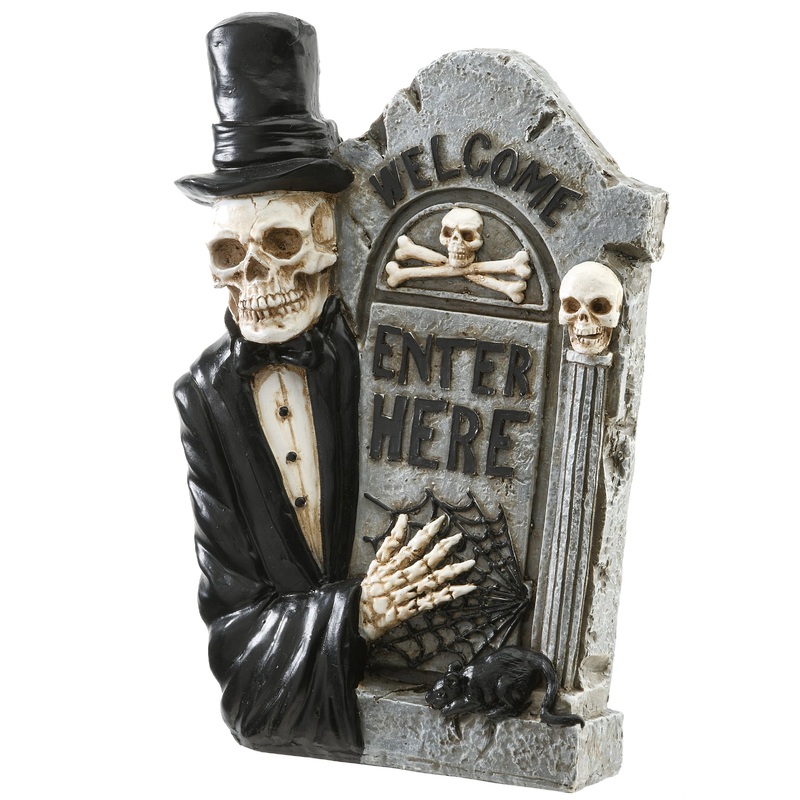 12 in. Halloween Skeleton Holding a Tombstone Decoration